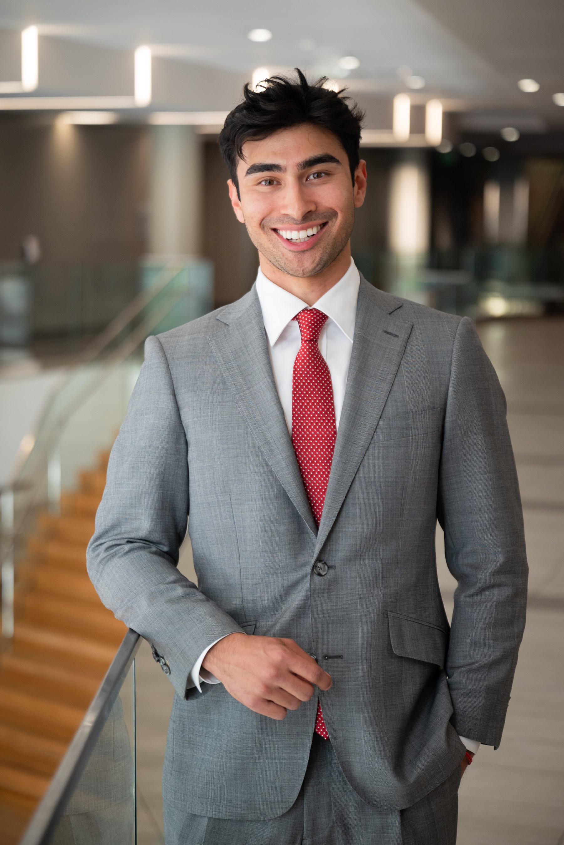 Samuel Katz smiling in a gray suit